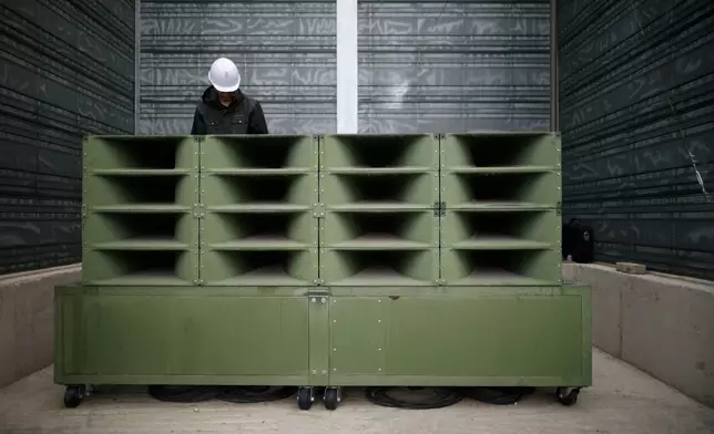 FILE - A worker dismantles loudspeakers that set up for propaganda broadcasts near the demilitarized zone separating the two Koreas in Paju, South Korea, on May 1, 2018. South Korea said Friday, July 19, 2024, it has restarted anti-Pyongyang propaganda broadcasts across the border in response to North Korea’s resumption of trash-carrying balloon launches. (Kim Hong-Ji/Pool Photo via AP, File)