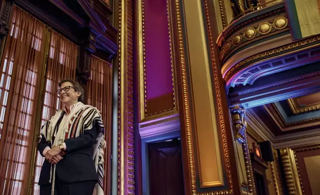 Rabbi Sharon Kleinbaum smiles during her last service at the Masonic Hall, Friday, June 28, 2024, in New York. After leading the nation’s largest LGBTQ+ synagogue through the myriad ups and downs of the modern gay-rights movement for the last three decades, she is now stepping down from that role and shifting into retirement. The synagogue that she led for 32 years — Congregation Beit Simchat Torah in midtown Manhattan — will have to grapple with its identity after being defined by its celebrity rabbi for so long. (AP Photo/Andres Kudacki)