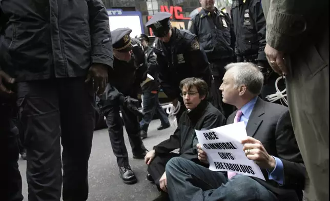 FILE - Matt Forman, right, Executive Director of the National Gay and Lesbian Task Force and Rabbi Sharon Kleinbaum, center, block traffic in New York's Times Square, in an act of civil disobedience, March 15, 2007. After 32 years as a progressive voice for LGBTQ Jews, and leader of Congregation Beit Simchat Torah in midtown Manhattan, Kleinbaum steps into retirement. (AP Photo/Seth Wenig, File)
