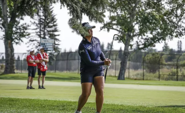 Megan Khang, of the United States, hits from the rough on the first hole during the second round at the LPGA Canadian Women's Open golf tournament in in Calgary, Alberta, Friday, July 26, 2024. (Jeff McIntosh /The Canadian Press via AP)