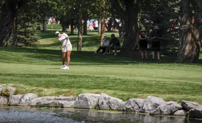 Lauren Coughlin, of the United States, hits from the fairway on the sixth hole during the second round at the LPGA Canadian Women's Open golf tournament in Calgary, Alberta, Friday, July 26, 2024. (Jeff McIntosh/The Canadian Press via AP)