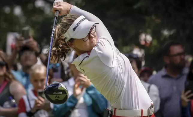 Canada's Brooke Henderson hits a tee shot on the second hole during the second round at the LPGA Canadian Women's Open golf tournament in Calgary, Alberta, Friday, July 26, 2024. (Jeff McIntosh/The Canadian Press via AP)