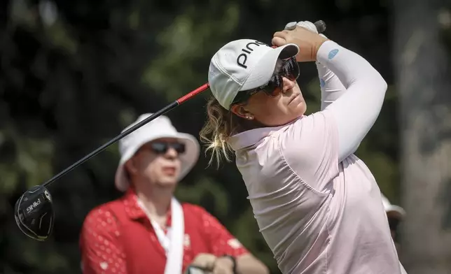 Lauren Coughlin, of the United States, hits a tee shot on the seventh hole during the second round at the LPGA Canadian Women's Open golf tournament in Calgary, Alberta, Friday, July 26, 2024. (Jeff McIntosh/The Canadian Press via AP)