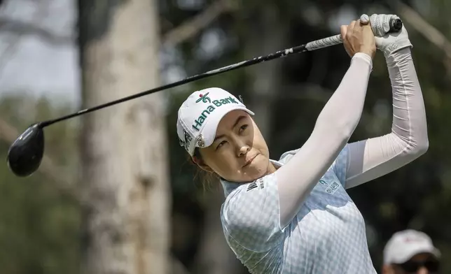 Australia's Minjee Lee hits a tee shot on the seventh hole during the second round at the LPGA Canadian Women's Open golf tournament in Calgary, Alberta, Friday, July 26, 2024. (Jeff McIntosh/The Canadian Press via AP)