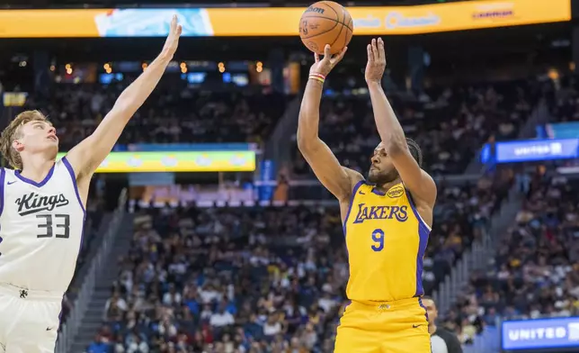 Sacramento Kings guard Dane Goodwin (33) attempts to block a shot by Los Angeles Lakers guard Bronny James (9) during the second half of an NBA summer league basketball game in San Francisco, Saturday, July 6, 2024. (AP Photo/Nic Coury)