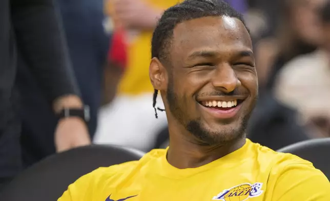 Los Angeles Lakers guard Bronny James laughs before an NBA summer league basketball game against Golden State Warriors in San Francisco , Sunday, July 7, 2024. (AP Photo/Nic Coury)