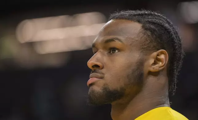 Los Angeles Lakers guard Bronny James watches warmup action before an NBA summer league basketball game against Golden State Warriors in San Francisco , Sunday, July 7, 2024. (AP Photo/Nic Coury)