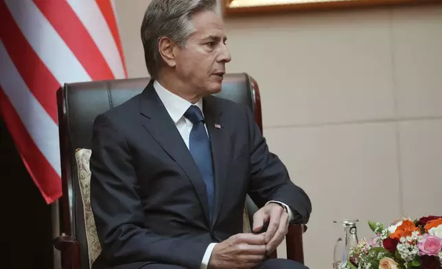 U.S. Secretary of State Antony Blinken talks with Lao Foreign Minister Saleumxay Kommasith during ASEAN Foreign Ministers Meeting (AMM) in Vientiane, Laos, Saturday, July 27, 2024. (AP Photo/Achmad Ibrahim, Pool)