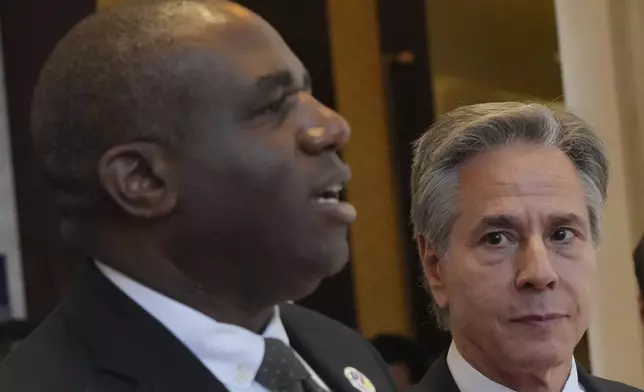 U.S. Secretary of State Antony Blinken, right, walks with British Foreign Secretary David Lammy during ASEAN Foreign Ministers Meeting (AMM) in Vientiane, Laos, Saturday, July 27, 2024. (AP Photo/Achmad Ibrahim, Pool)