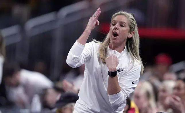 Indiana Fever head coach Christie Sides calls a play during the first half of a WNBA basketball game against the New York Liberty, Saturday, July 6, 2024, in Indianapolis. (AP Photo/Darron Cummings)