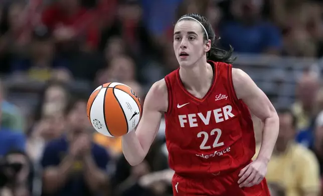 Indiana Fever's Caitlin Clark dribbles during the second half of a WNBA basketball game against the New York Liberty, Saturday, July 6, 2024, in Indianapolis. (AP Photo/Darron Cummings)