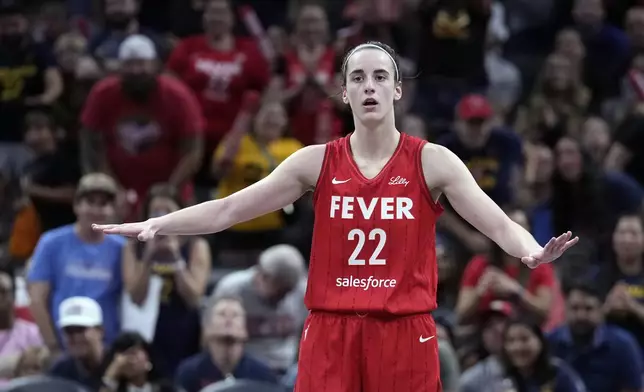 Indiana Fever's Caitlin Clark reacts during the second half of a WNBA basketball game against the New York Liberty, Saturday, July 6, 2024, in Indianapolis. (AP Photo/Darron Cummings)