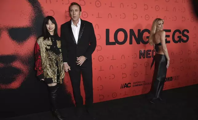 Riko Cage, from left, Nicolas Cage and Maika Monroe arrive at the premiere of "Longlegs" at the Egyptian Theatre on Monday July 8, 2024, in Los Angeles. (Photo by Richard Shotwell/Invision/AP)