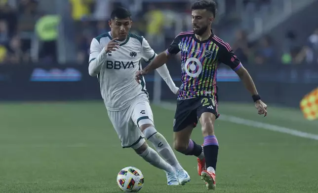 Liga MX All-Stars' Bryan Gonzalez, left, and MLS All-Stars' Diego Rossi chase the ball during the first half of the MLS All-Star soccer match Wednesday, July 24, 2024, in Columbus, Ohio. (AP Photo/Jay LaPrete)