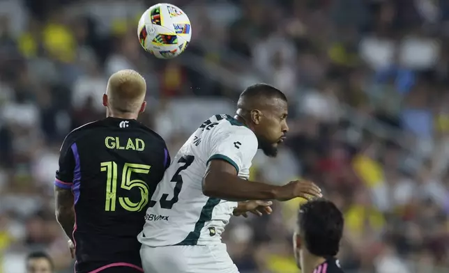 MLS All-Stars' Justin Glad, left, and Liga MX All-Stars' Salomon Rondon jump to head the ball during the first half of the MLS All-Star soccer match Wednesday, July 24, 2024, in Columbus, Ohio. (AP Photo/Jay LaPrete)