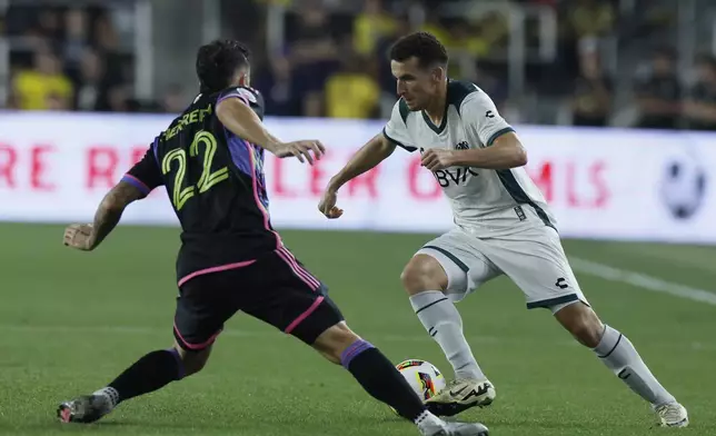 Liga MX All-Stars' Oussama Idrissi, right, dribbles past MLS All-Stars' Aaron Herrera during the first half of the MLS All-Star soccer match, Wednesday, July 24, 2024, in Columbus, Ohio. (AP Photo/Jay LaPrete)