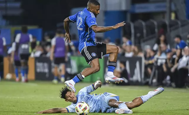 CF Montreal's Ruan, top, leaps over Atlanta United defender Ronald Hernández, bottom, during second-half MLS soccer match action in Montreal, Saturday, July 13, 2024. (Graham Hughes/The Canadian Press via AP)