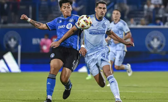 CF Montreal's Fernando Álvarez (4) challenges Atlanta United's Daniel Ríos (19) during the second half of an MLS soccer match in Montreal, Saturday, July 13, 2024. (Graham Hughes/The Canadian Press via AP)