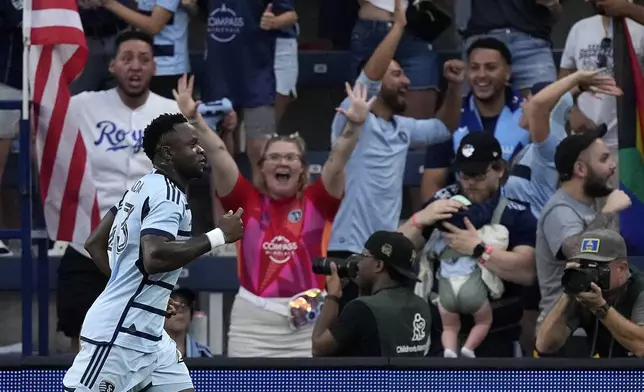 Sporting Kansas City attacker Willy Agada celebrates after scoring a goal during the first half of an MLS soccer match against FC Dallas Sunday, July 7, 2024, in Kansas City, Kan. (AP Photo/Charlie Riedel)