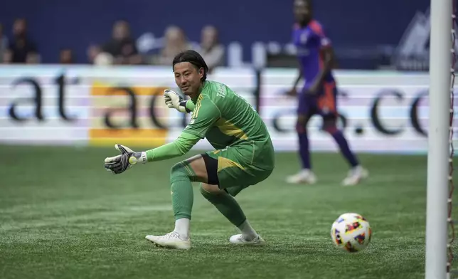 Vancouver Whitecaps goalkeeper Yohei Takaoka allows a goal to Houston Dynamo's Adalberto Carrasquilla (not shown) during the first half of an MLS soccer match in Vancouver, British Columbia, Saturday, July 20, 2024. (Darryl Dyck/The Canadian Press via AP)