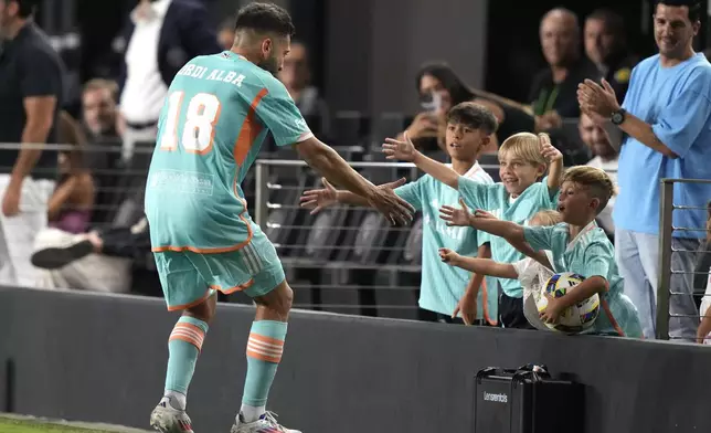 Inter Miami defender Jordi Alba (18) celebrates after scoring a goal during the second half of an MLS soccer match against Chicago Fire, Saturday, July 20, 2024, in Fort Lauderdale, Fla. (AP Photo/Lynne Sladky)