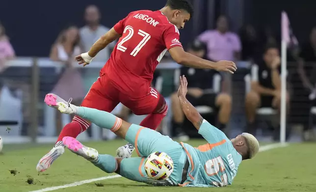 Inter Miami defender Marcelo Weigandt (57) falls as he goes for the ball against Chicago Fire defender Allan Arigoni (27) during the first half of an MLS soccer match, Saturday, July 20, 2024, in Fort Lauderdale, Fla. (AP Photo/Lynne Sladky)