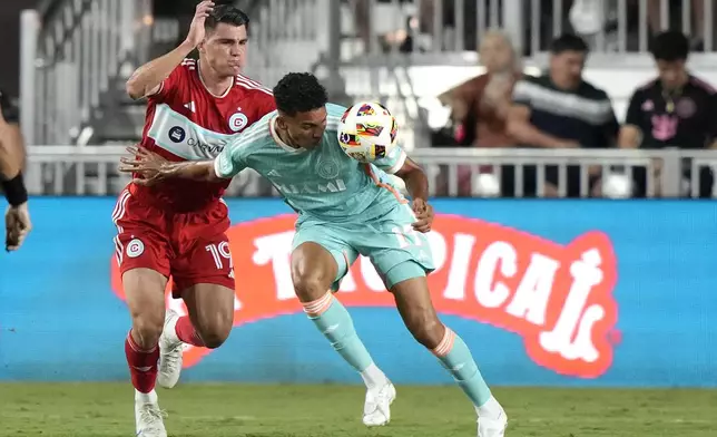 Inter Miami defender Ian Fray (17) heads the ball as Chicago Fire forward Georgios Koutsias (19) defends during the second half of an MLS soccer match, Saturday, July 20, 2024, in Fort Lauderdale, Fla. (AP Photo/Lynne Sladky)