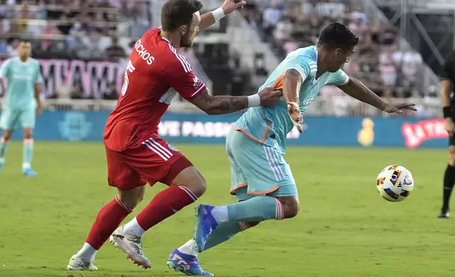 Inter Miami forward Luis Suárez, right, goes for the ball as Chicago Fire defender Rafael Czichos (5) defends during the first half of an MLS soccer match, Saturday, July 20, 2024, in Fort Lauderdale, Fla. (AP Photo/Lynne Sladky)