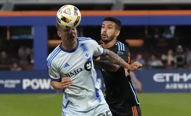 CF Montreal defender Gabriele Corbo, left, and New York City FC midfielder Santiago Rodríguez battle for the ball during an MLS soccer match, Wednesday, July 3, 2024, in New York. (AP Photo/Pamela Smith)