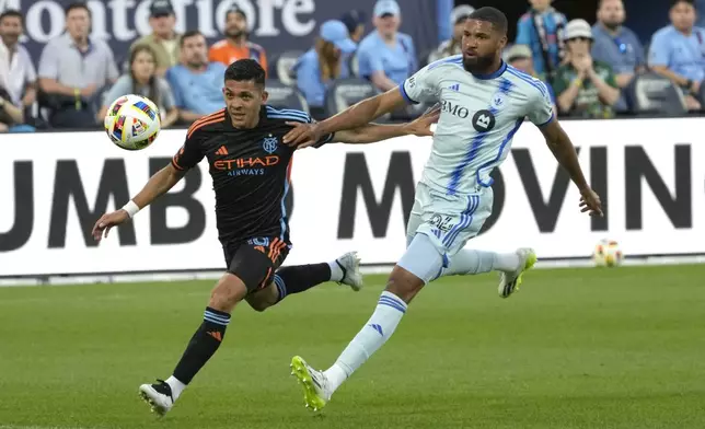 New York City CF forward Alonso Martínez, left, chases after the ball with CF Montréal defender George Campbell during an MLS soccer match, Wednesday, July 3, 2024, in New York. (AP Photo/Pamela Smith)