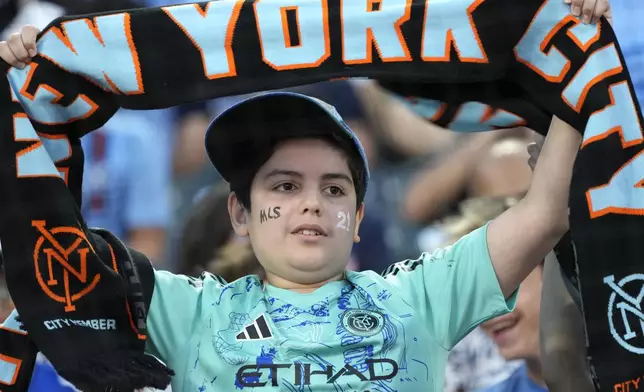 A fan celebrates a goal scored by New York City FC forward Alonso Martínez during an MLS soccer match against CF Montréal, Wednesday, July 3, 2024, in New York. (AP Photo/Pamela Smith)
