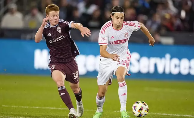 St. Louis City forward Nökkvi Þórisson, right, pursues the ball with Colorado Rapids midfielder Oliver Larraz in the second half of a soccer match Sunday, July 7, 2024, in Commerce City, Colo. (AP Photo/David Zalubowski)