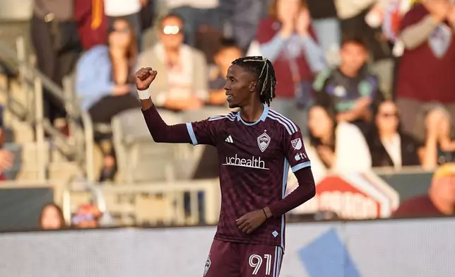 Colorado Rapids forward Kévin Cabral celebrates after scoring a goal in the first half of a soccer match against St. Louis City, Sunday, July 7, 2024, in Commerce City, Colo. (AP Photo/David Zalubowski)