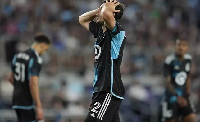 Minnesota United defender Devin Padelford (2) reacts after missing a shot attempt during the second half of an MLS soccer match against the Vancouver Whitecaps in St. Paul, Minn., Wednesday, July 3, 2024. (AP Photo/Abbie Parr)