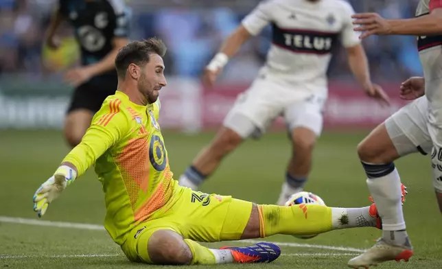 Minnesota United goalkeeper Alec Smir attempts to stop a pass resulting in a Vancouver Whitecaps goal during the first half of an MLS soccer match in St. Paul, Minn., Wednesday, July 3, 2024. (AP Photo/Abbie Parr)