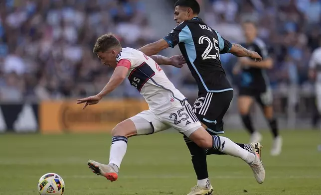 Vancouver Whitecaps midfielder Ryan Gauld, left, and Minnesota United midfielder Alejandro Bran battle for possession during the first half of an MLS soccer match in St. Paul, Minn., Wednesday, July 3, 2024. (AP Photo/Abbie Parr)