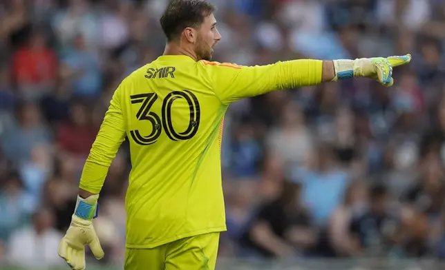 Minnesota United goalkeeper Alec Smir (30) points during the first half of an MLS soccer match against the Vancouver Whitecaps in St. Paul, Minn., Wednesday, July 3, 2024. (AP Photo/Abbie Parr)