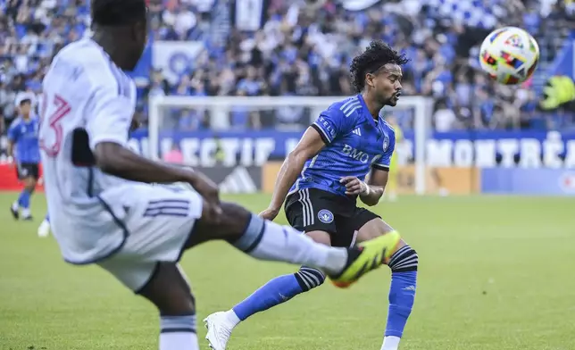 Vancouver Whitecaps' Javain Brown (23) clears the ball past CF Montreal's Ariel Lassiter (11) during the first half of a MLS soccer game in Montreal, Saturday, July 6, 2024. (Graham Hughes/The Canadian Press via AP)