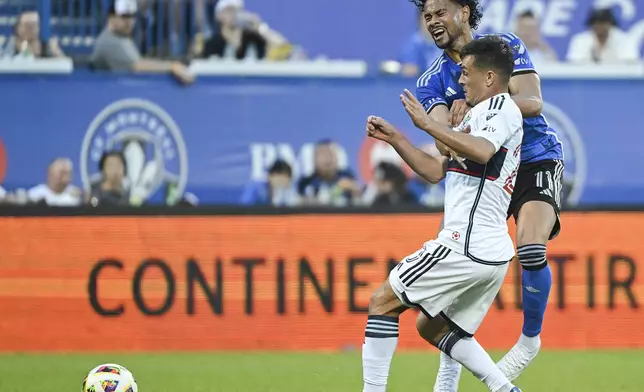 Vancouver Whitecaps midfielder Andres Cubas (20) moves in on CF Montreal's Ariel Lassiter (11) during the first half of an MLS soccer game in Montreal, Saturday, July 6, 2024. (Graham Hughes/The Canadian Press via AP)