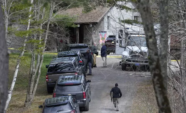 FILE - Investigators work at the scene of a shooting where four people were killed on April 18, 2023, in Bowdoin, Maine. Joseph Eaton, who's charged with killing four people and injuring three others, is due in court Monday, July 1, 2024, for a plea hearing which his lawyer said will resolve all of his criminal charges. (AP Photo/Robert F. Bukaty, File)
