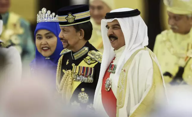 Bahrain's King Hamad bin Isa Al Khalifa, front right, Sultan of Brunei Hassanal Bolkiah, center, and Queen of Brunei Pengiran Anak Saleha attend the coronation ceremony of the 17th King of Malaysia Sultan Ibrahim Iskandar at the National Palace in Kuala Lumpur, Malaysia, Saturday, July 20, 2024. (Hasnoor Hussain/Pool Photo via AP)