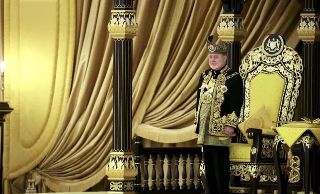 The 17th King of Malaysia, Sultan Ibrahim Iskandar stands in front of the throne during his coronation at the National Palace in Kuala Lumpur, Malaysia, Saturday, July 20, 2024. (Hasnoor Hussain/Pool Photo via AP)