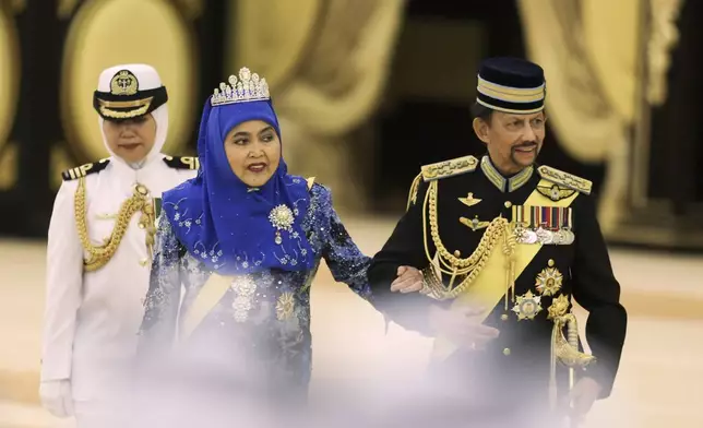 Sultan of Brunei Hassanal Bolkiah and Queen of Brunei Pengiran Anak Saleha attend the coronation ceremony of the 17th King of Malaysia Sultan Ibrahim Iskandar at the National Palace in Kuala Lumpur, Malaysia, Saturday, July 20, 2024. (Hasnoor Hussain/Pool Photo via AP)