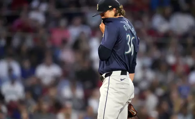 Seattle Mariners pitcher Logan Gilbert reacts after giving up a two-run home run to Boston Red Sox's Masataka Yoshida during the third inning of a baseball game, Monday, July 29, 2024, in Boston. (AP Photo/Charles Krupa)