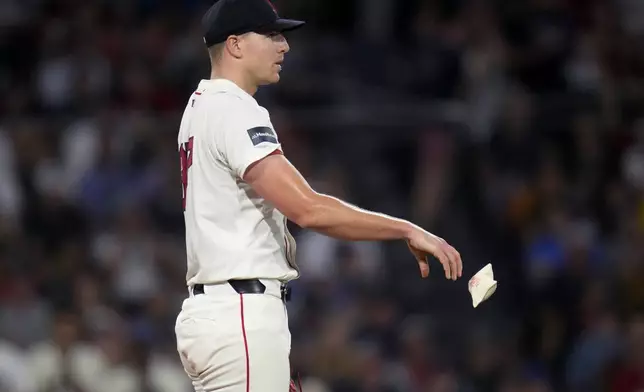 Boston Red Sox pitcher Nick Pivetta tosses the rosin bag after giving up a back-to-back home runs during the sixth inning of a baseball game against the Seattle Mariners, Monday, July 29, 2024, in Boston. (AP Photo/Charles Krupa)