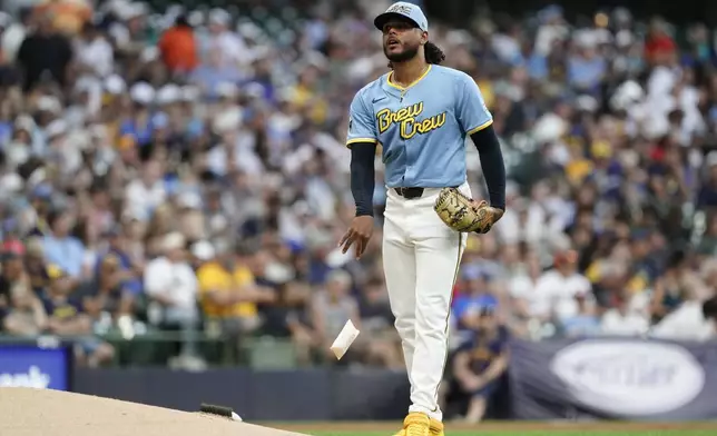 Milwaukee Brewers' Freddy Peralta reacts during the second inning of a baseball game against the Miami Marlins, Friday, July 26, 2024, in Milwaukee. (AP Photo/Aaron Gash)