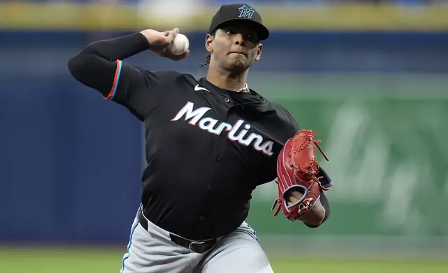 Miami Marlins starting pitcher Edward Cabrera delivers to the Tampa Bay Rays during the first inning of a baseball game Tuesday, July 30, 2024, in St. Petersburg, Fla. (AP Photo/Christopher O'Meara)