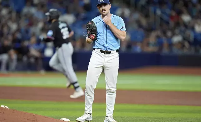 Tampa Bay Rays relief pitcher Tyler Alexander reacts as Miami Marlins' Jake Burger runs around the bases after his solo home run during the fifth inning of a baseball game Tuesday, July 30, 2024, in St. Petersburg, Fla. (AP Photo/Christopher O'Meara)