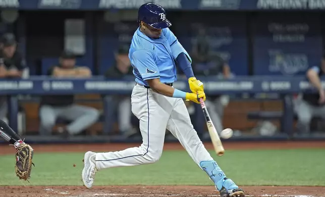 Tampa Bay Rays' Christopher Morel connects for a solo home run off Miami Marlins starting pitcher Edward Cabrera during the fourth inning of a baseball game Tuesday, July 30, 2024, in St. Petersburg, Fla. (AP Photo/Christopher O'Meara)