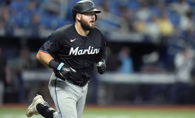 Miami Marlins' Jake Burger runs the bases after his solo home run off Tampa Bay Rays relief pitcher Tyler Alexander during the fifth inning of a baseball game Tuesday, July 30, 2024, in St. Petersburg, Fla. (AP Photo/Christopher O'Meara)